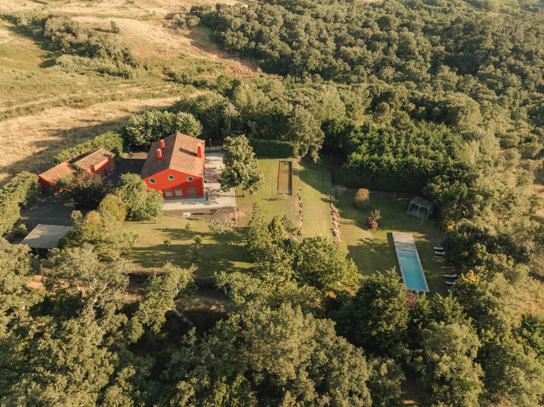 Aerial view of Big Red Barn, its gardens and the countryside beyond